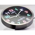 Fémkeretes analóg quartz falióra színes LED számlappal, 25.5 cm Fémkeretes analóg quartz falióra színes LED számlappal, 25.5 cm